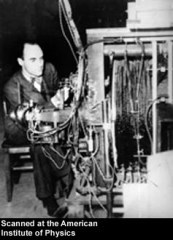 Anderson and his cloud chamber.  Note how similarly it looks to the AMS (except turned on its side).  This is because the coil magnet remains a central part of distinguishing charged particles.  Source: National Archives and Records Administration and California Institute of Technology, digital file courtesy AIP Emilio Segrè Visual Archives